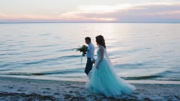 Bride and groom near the sea — Stock Video