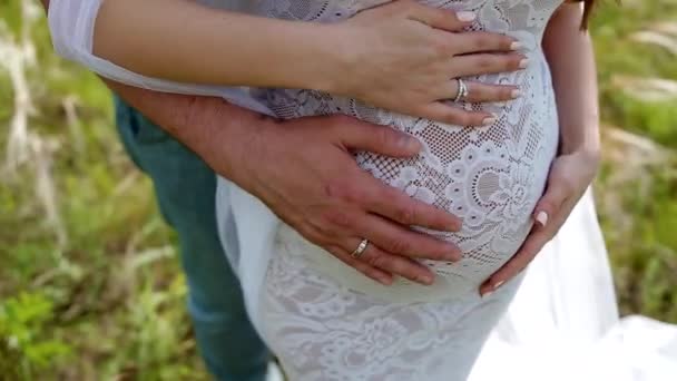 White pregnant young woman and her husband — Stock Video