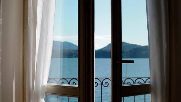 View of Lago Maggiore through opening window — Stock Video