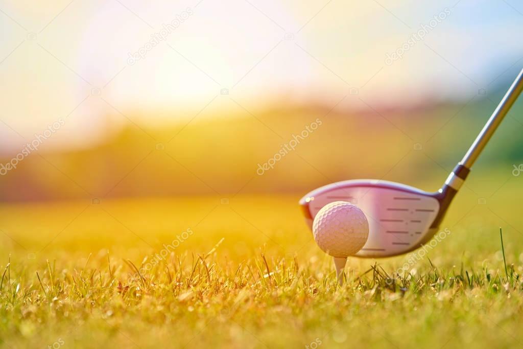 Golfing ball on a green grass.