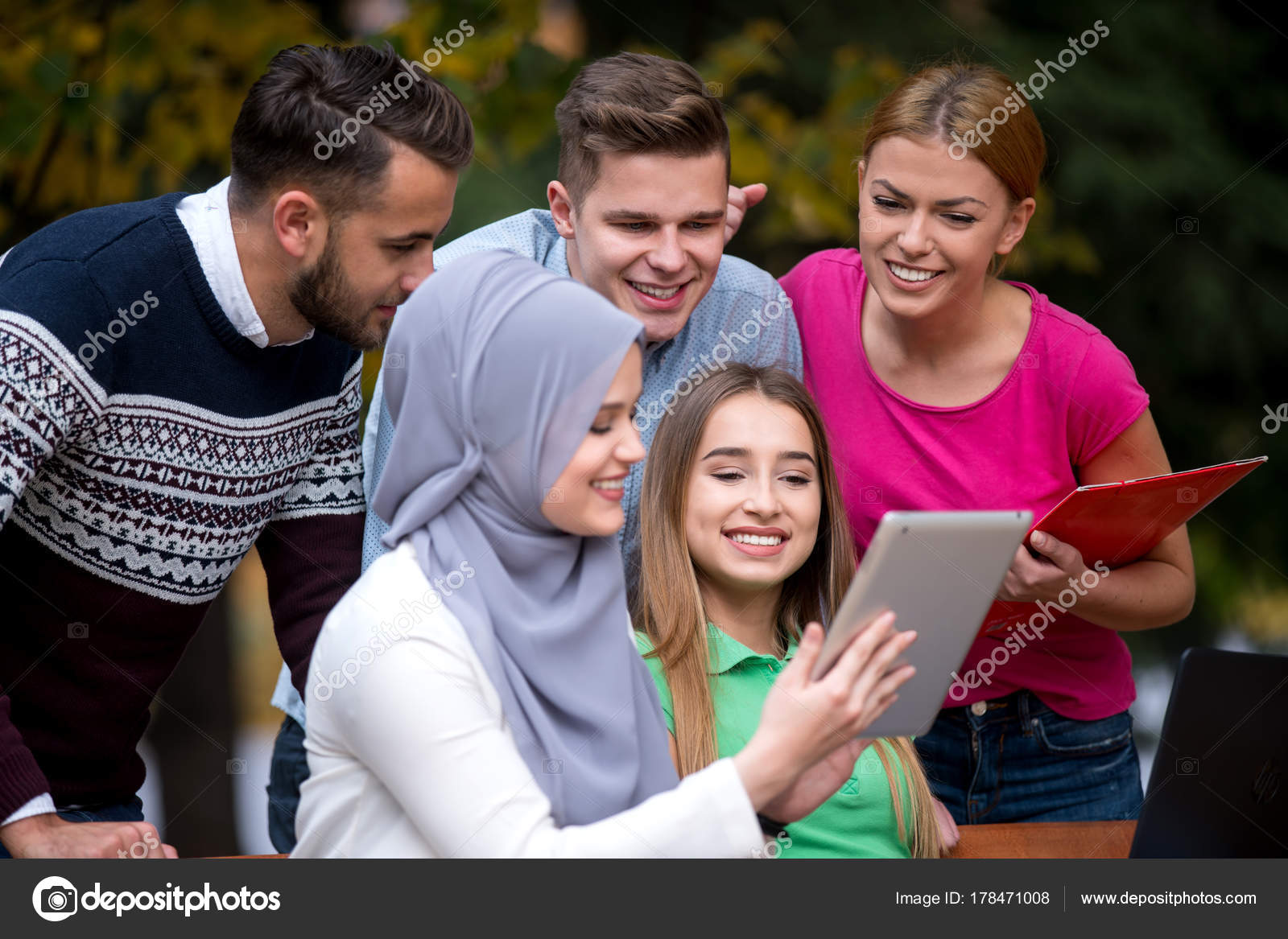 Group Young People Using Laptop Tablet Park Bench Having Fun