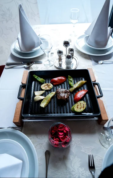 Light veggie and beef dish served traditionaly on a cast iron pan