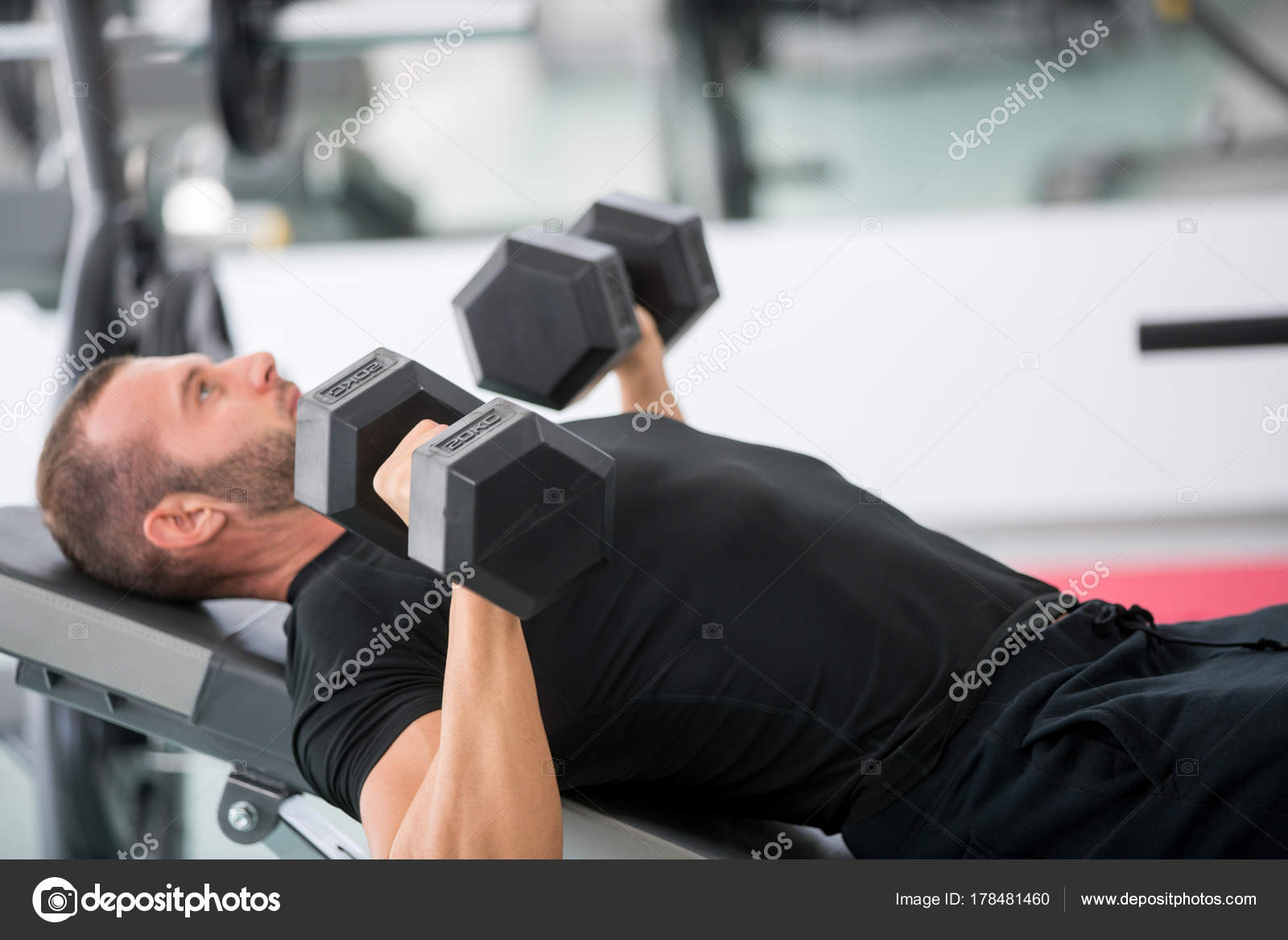 Young Handsome Adult Male Doing Dumbbell Rows Bench Modern Gym