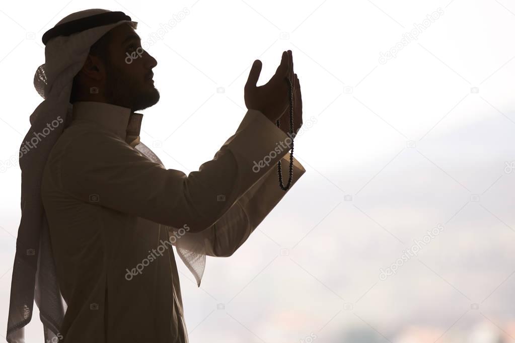 Religious muslim man praying inside the mosque