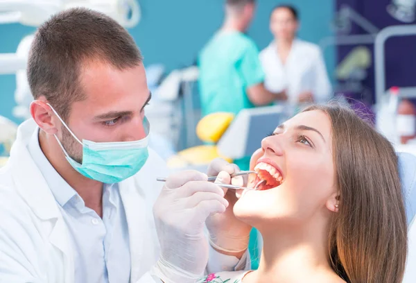 Doctor talking with her patient. Dentist concept