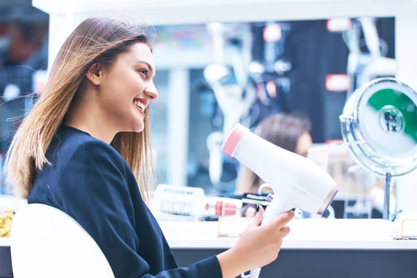 Haircare Beautiful Long Haired Woman Drying Hair Electronic Store — Stock Photo, Image