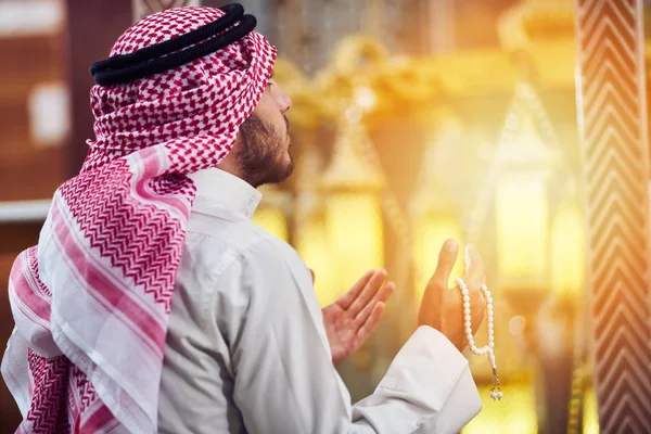 Religious muslim man praying inside the mosque