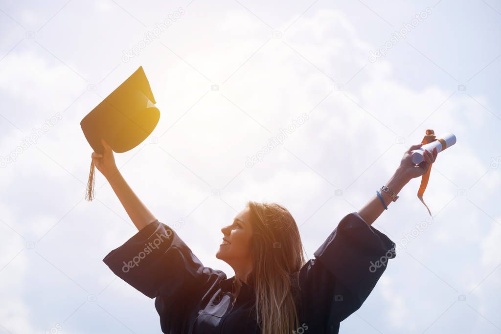 Happy woman on her graduation day University. Education and people.