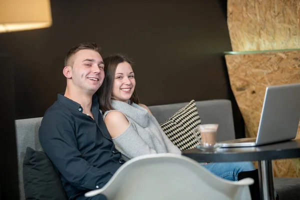 Young couple having fun at a caffe shop. — Stock Photo, Image