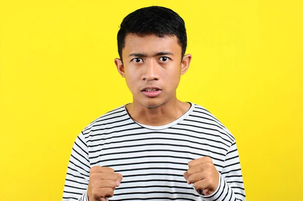 Young Asian man doing angry gesture, annoyed, and emotional, iso — Stock Photo, Image