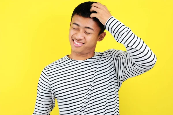 Portrait of confused man, isolated on yellow — Stock Photo, Image