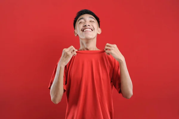 Young Man Wearing Casual Shirt Smelling Fresh Clean Clothes Isolated — Stock Photo, Image