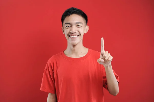 Young Asian Man Number One Sign Finger Gesture Isolated Red — Stock Photo, Image