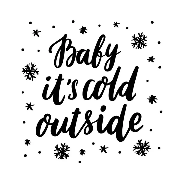 Die Inschrift "Baby it 's cold outside" mit Schneeflocken-Handzeichnung aus schwarzer Tinte auf weißem Hintergrund. — Stockvektor