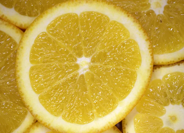 Fresh juicy orange. Abstract background with citrus-fruit of orange slices. Close-up