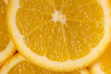 Taze dilimlenmiş portakal meyvesi dokusu. Makro, üst görünüm, kopyalama alanı. Yemek çerçevesi. Sulu portakal arkaplanı.