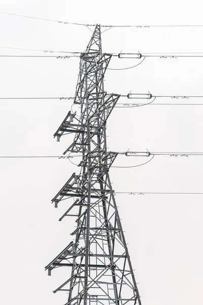 Electricity distribution system. High voltage overhead power line, power pylon, steel lattice tower details.