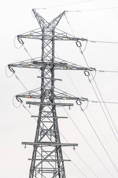 Electricity distribution system. High voltage overhead power line, power pylon, steel lattice tower details.