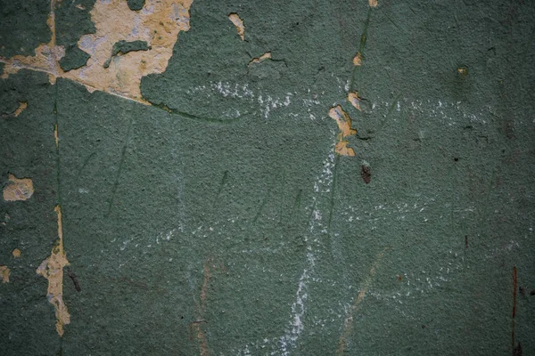 Texture di una vecchia parete ricoperta di vernice. Immagine di sfondo di un — Foto Stock