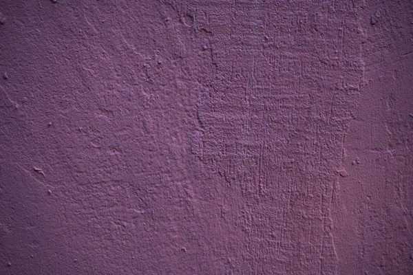 Textura de uma parede velha coberta de tinta. Imagem de fundo de um — Fotografia de Stock