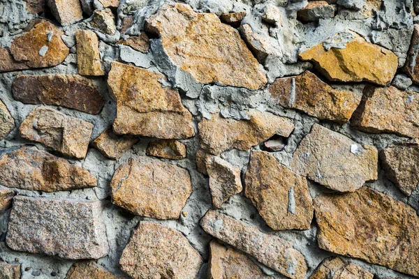 The texture of the old masonry. Background image of a stone-line — Stock Photo, Image