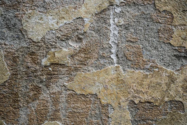 Textura de una vieja pared cubierta de pintura. Imagen de fondo de una — Foto de Stock