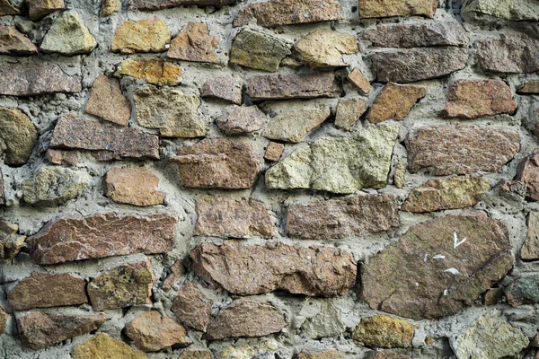 La textura de la antigua mampostería. Imagen de fondo de una línea de piedra — Foto de Stock