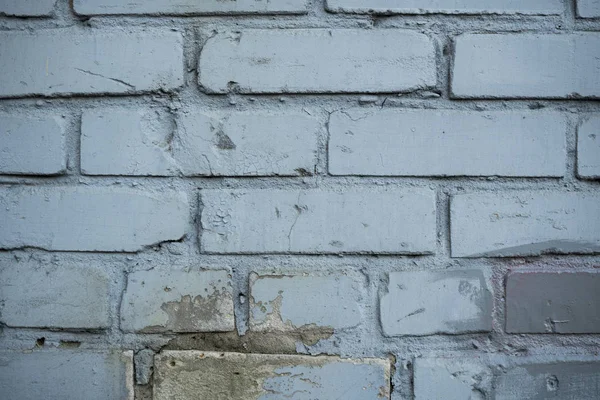 Текстура старої фарби покрита цегляною стіною. Зображення тла — стокове фото