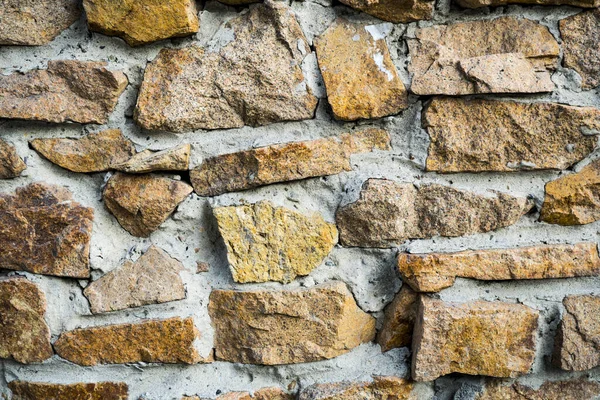 The texture of the old masonry. Background image of a stone-line — Stock Photo, Image