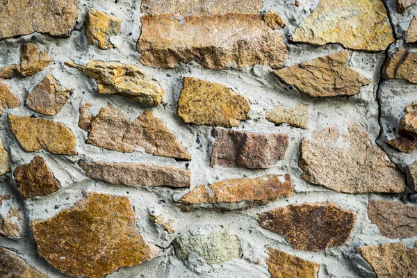 The texture of the old masonry. Background image of a stone-line — Stock Photo, Image