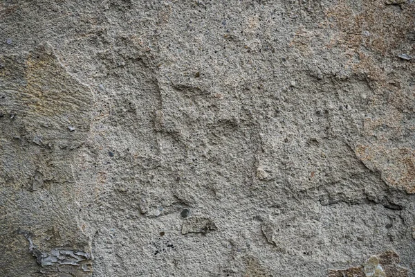 Textuur van een oude muur bedekt met verf. Achtergrondafbeelding van een — Stockfoto