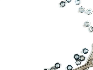 Text insertion frame lined with bolts, nuts and wrenches