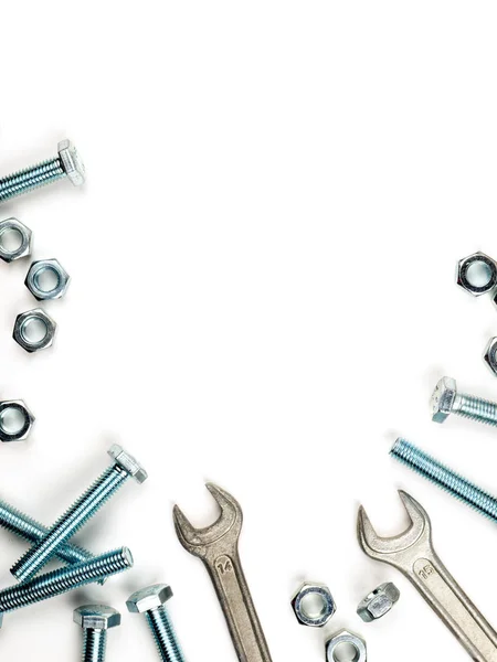 Text insertion frame lined with bolts, nuts and wrenches — Stock Photo, Image