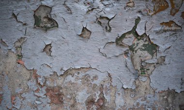 Boya ile kaplı eski bir duvarın dokusu. Yıpranmış boya kaplı yüzeyin arka plan görüntüsü