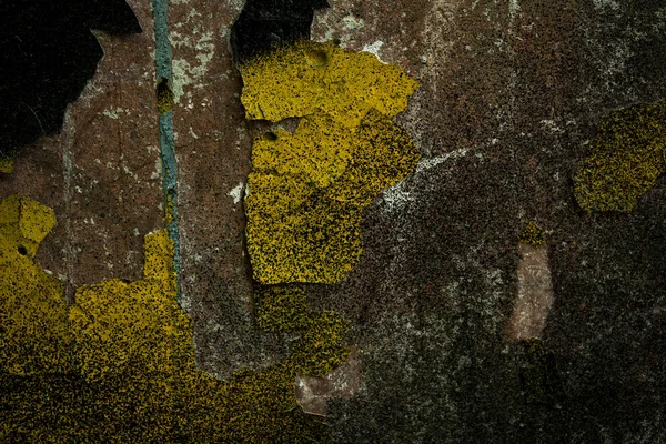 The texture of the old concrete wall covered with paint. Texture of cracked old paint. A background image of a helmet painted wall. Old graffiti on a concrete wall shot at close range. Graphic resources abstract textured background.