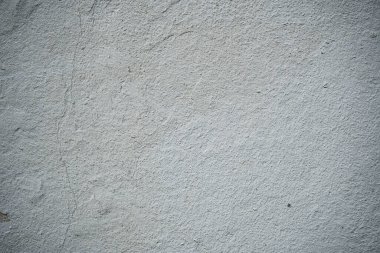 Boya ile kaplı eski bir duvarın dokusu. Yıpranmış boya kaplı yüzeyin arka plan görüntüsü