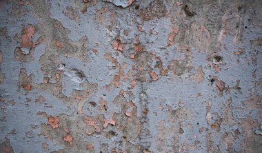 Boya ile kaplı eski bir duvarın dokusu. Yıpranmış boya kaplı yüzeyin arka plan görüntüsü