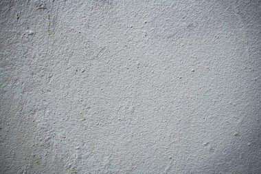 Boya ile kaplı eski bir duvarın dokusu. Yıpranmış boya kaplı yüzeyin arka plan görüntüsü