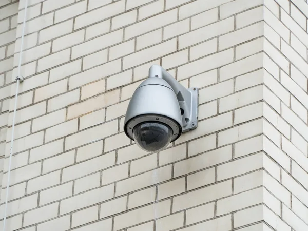 Image of a cctv camera. Private area is safe. Big brother is watching you. Video surveillance for security. A fixed operational surveillance camera. Protection against criminals.