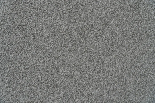 Kumaşlı boyayla kaplı bir duvarın arkaplan resmi. Duvar kağıdı. Metin için substrat. Dekoratif sıva deseni. İç ve dış duvarlar var. Üst görünüm.