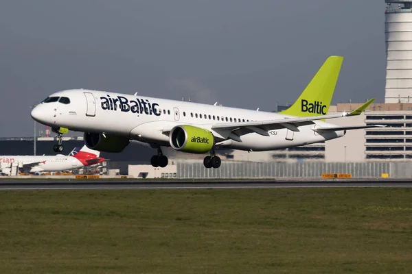 Air Baltic Airbus A220-300 YL-CSJ passenger plane arrival and landing at Vienna International Airport