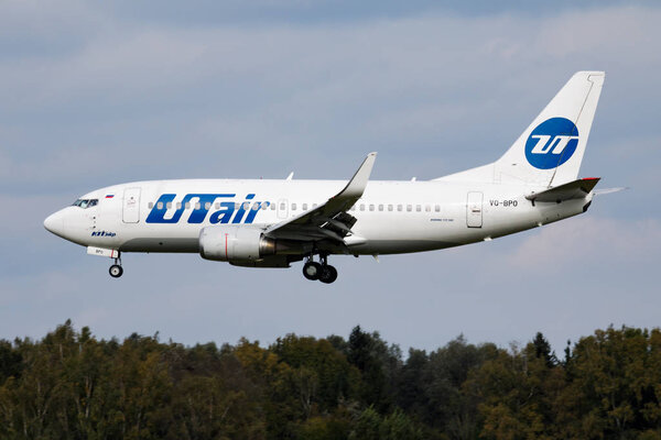 UTair Boeing 737-500 VQ-BPO passenger plane arrival and landing at Munich Airport