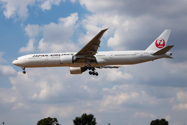 LONDON / UNITED KINGDOM - JULY 14, 2018: JAL Japan Airlines Boeing 777-300ER JA737J passenger plane landing at London Heathrow Airport