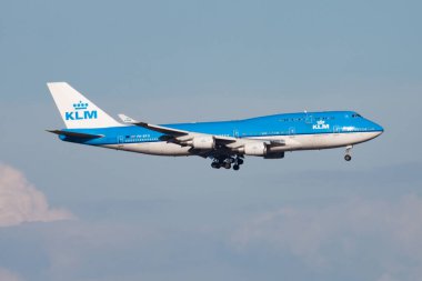 Amsterdam / Netherlands - August 13, 2014: KLM Royal Dutch Airlines Boeing 747-400 Jumbojet PH-BFU passenger plane arrival and landing at Amsterdam Schipol Airport clipart