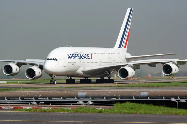 Paris / France - April 24, 2015: Air France Airbus A380 F-HPJI passenger plane arrival and landing at Paris Charles de Gaulle Airport