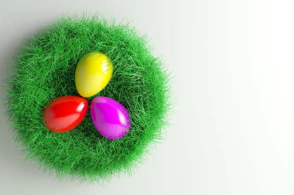 Pasen Nest met drie kleurrijke eieren Stockfoto