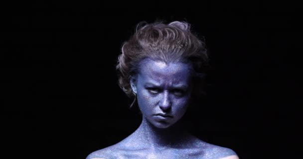 Girl Blue Face Sparkles Close Black Wall — Stock Video