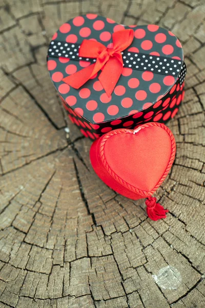 Heart Shape of Gift Box on Wooden Trunk — Stock Photo, Image
