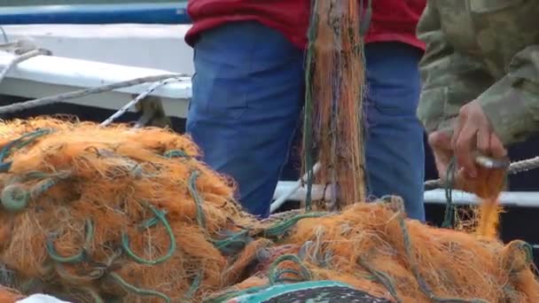 Fisherman Repairs Fishnet Fishing Lines — Stock Video