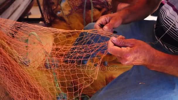 Fisherman Repairs Fishnet Fishing Lines — Stock Video